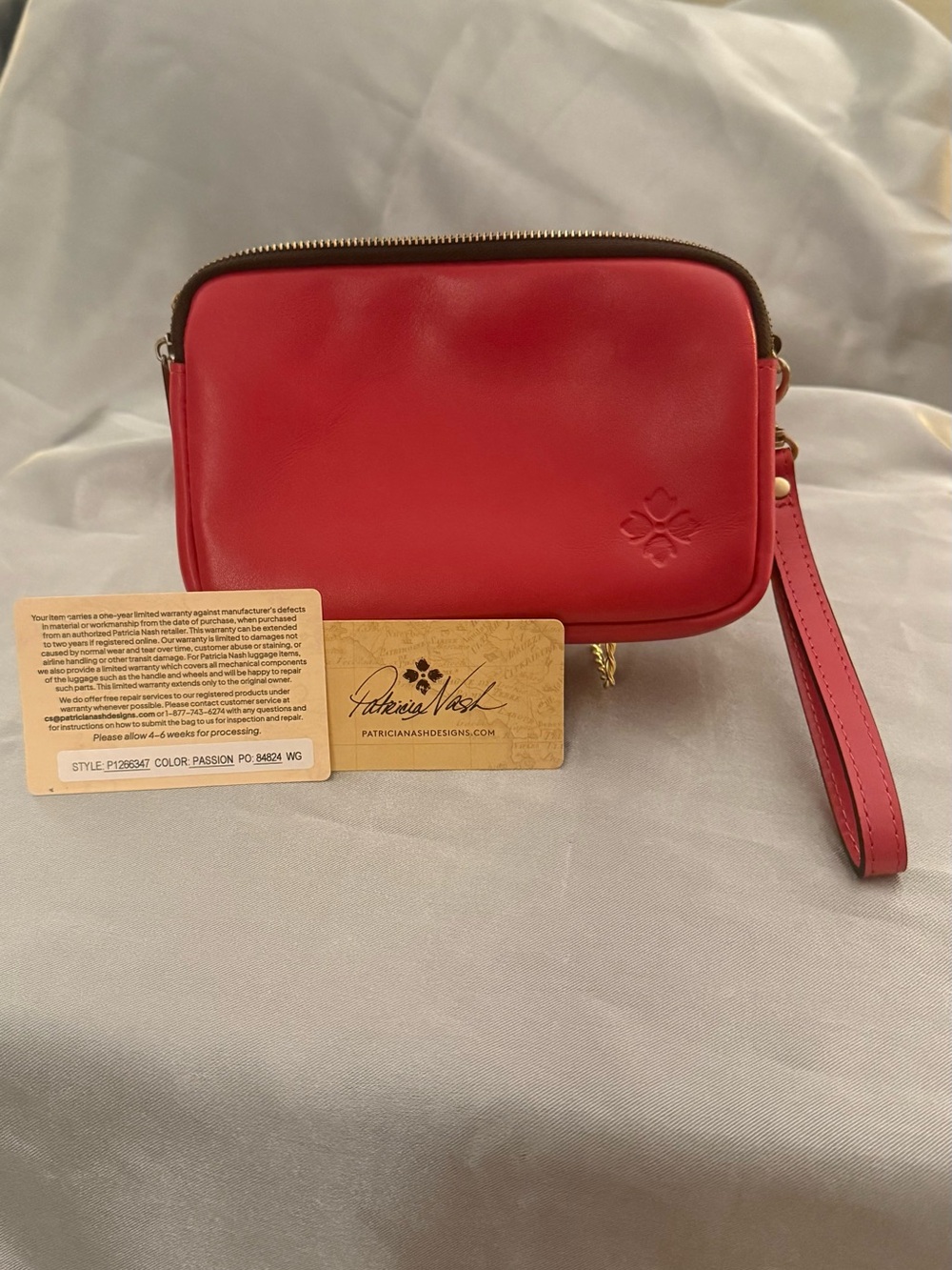 Patricia Nash Leather Wristlet Clutch with Wrist Strap in the color, “Passion”